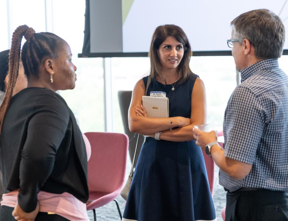 A group of Georgia Tech faculty talking.