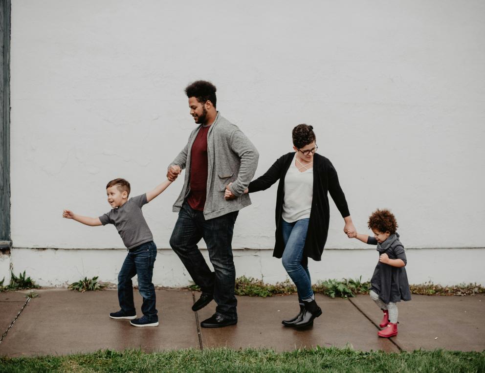 A family with two parents and two children.